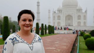 Susan on location in Susan Calman's Cruise of a lifetime wearing a white top