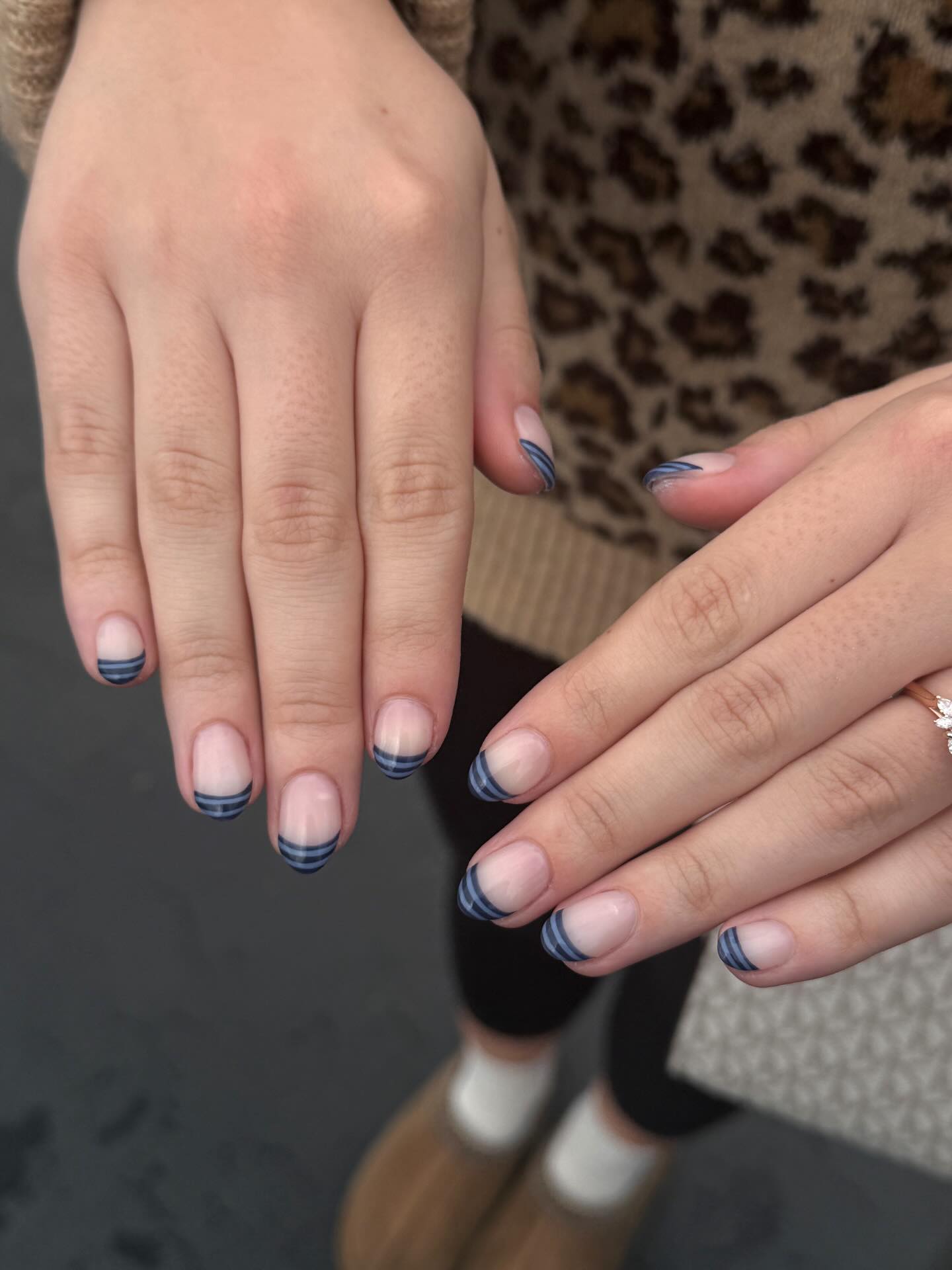 Blue and navy short striped French tips.