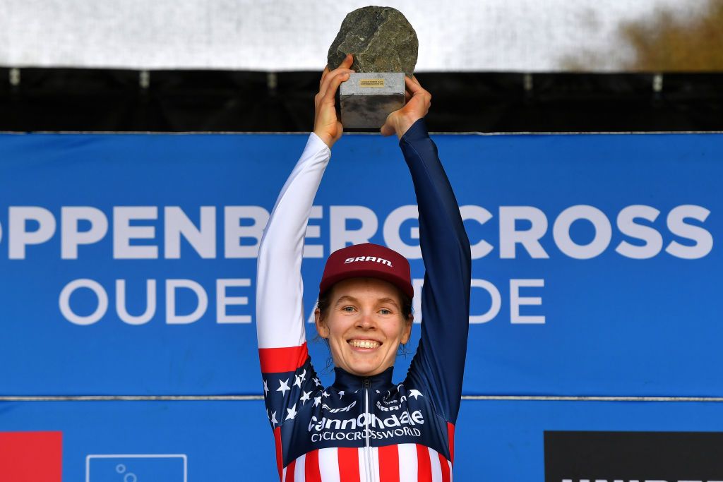 OUDENAARDE BELGIUM NOVEMBER 01 Clara Honsinger of The United States and Team CannondaleCyclocrossworld celebrates with the cobblestoneracetrophy at podium as race winner after the 32nd Koppenbergcross Grand Prix Jolien Verschueren 2021 Womens Elite Koppenbergcross Oudenaarde X2OBadkamersTrofee on November 01 2021 in Oudenaarde Belgium Photo by Luc ClaessenGetty Images
