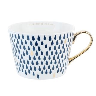 mug with golden handle and raindrops pattern