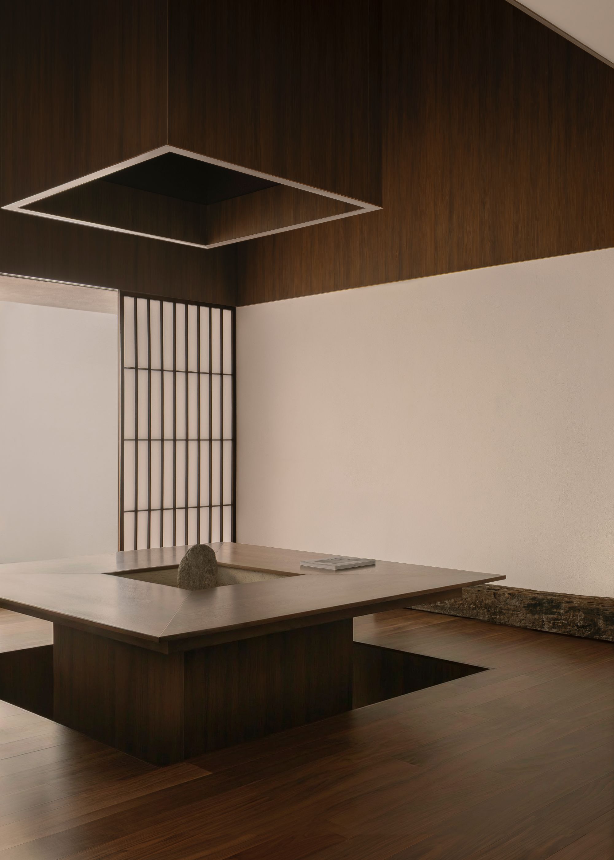 A white room with wooden accents, a seated dining space with a recessed wall above