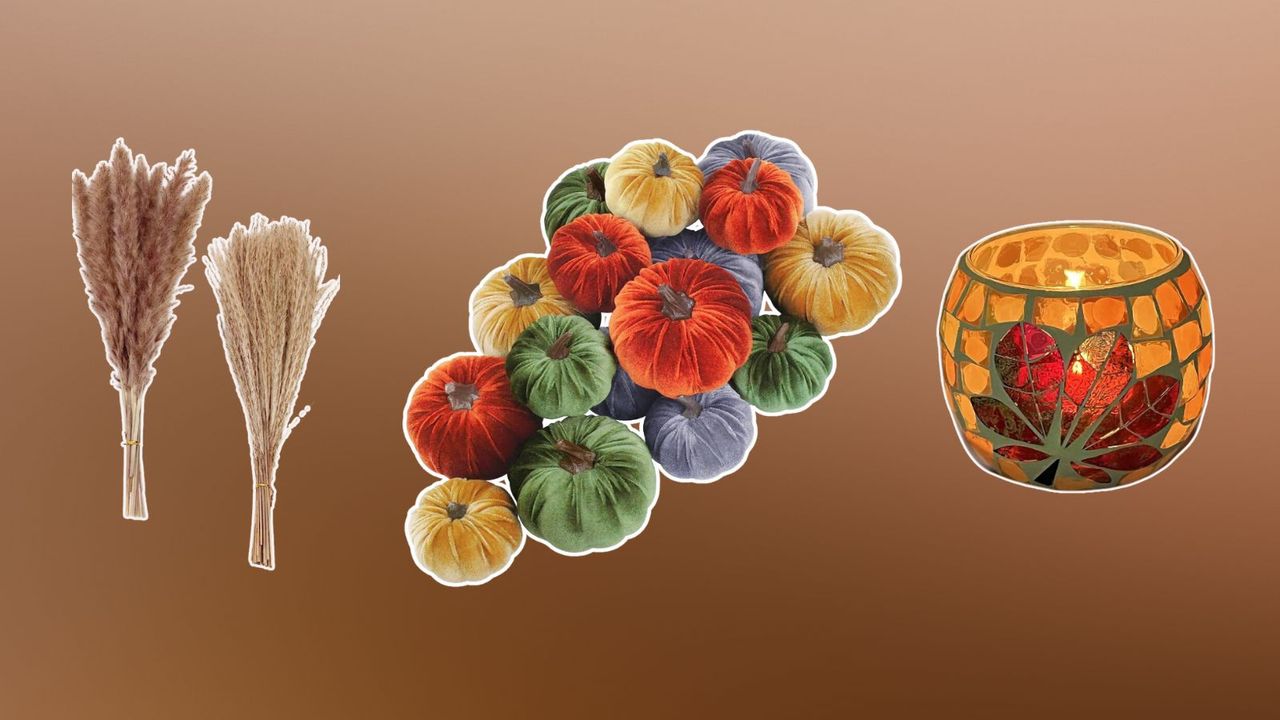 Thanksgiving table decor, including dried flowers, velvet pumpkins, and a candle holder on a brown background