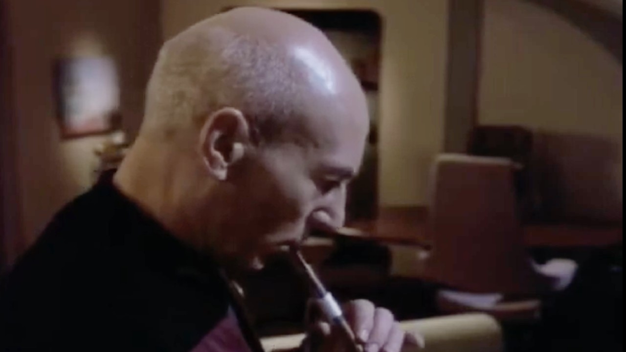 Picard playing his flute.