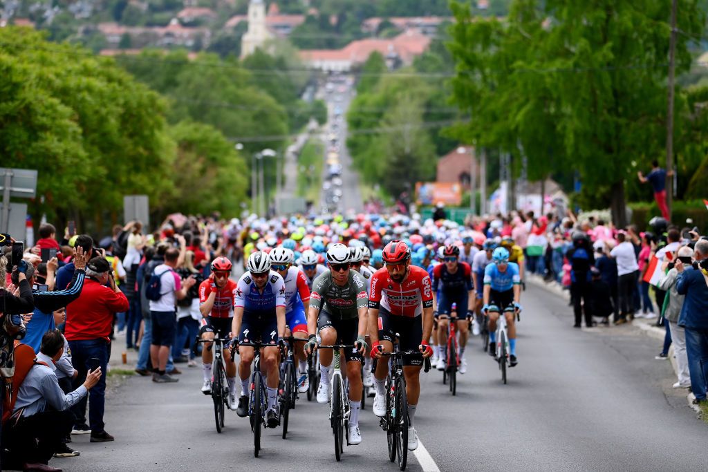 BALATONFURED HUNGARY MAY 08 A general view of Pieter Serry of Belgium and Team QuickStep Alpha Vinyl Senne Leysen of Belgium and Team Alpecin Fenix and Thomas De Gendt of Belgium and Team Lotto Soudal lead the peloton passing through Eszterglyhorvti village lduring the 105th Giro dItalia 2022 Stage 3 a 201km stage from Kaposvr to Balatonfred Giro WorldTour on May 08 2022 in Balatonfured Hungary Photo by Tim de WaeleGetty Images