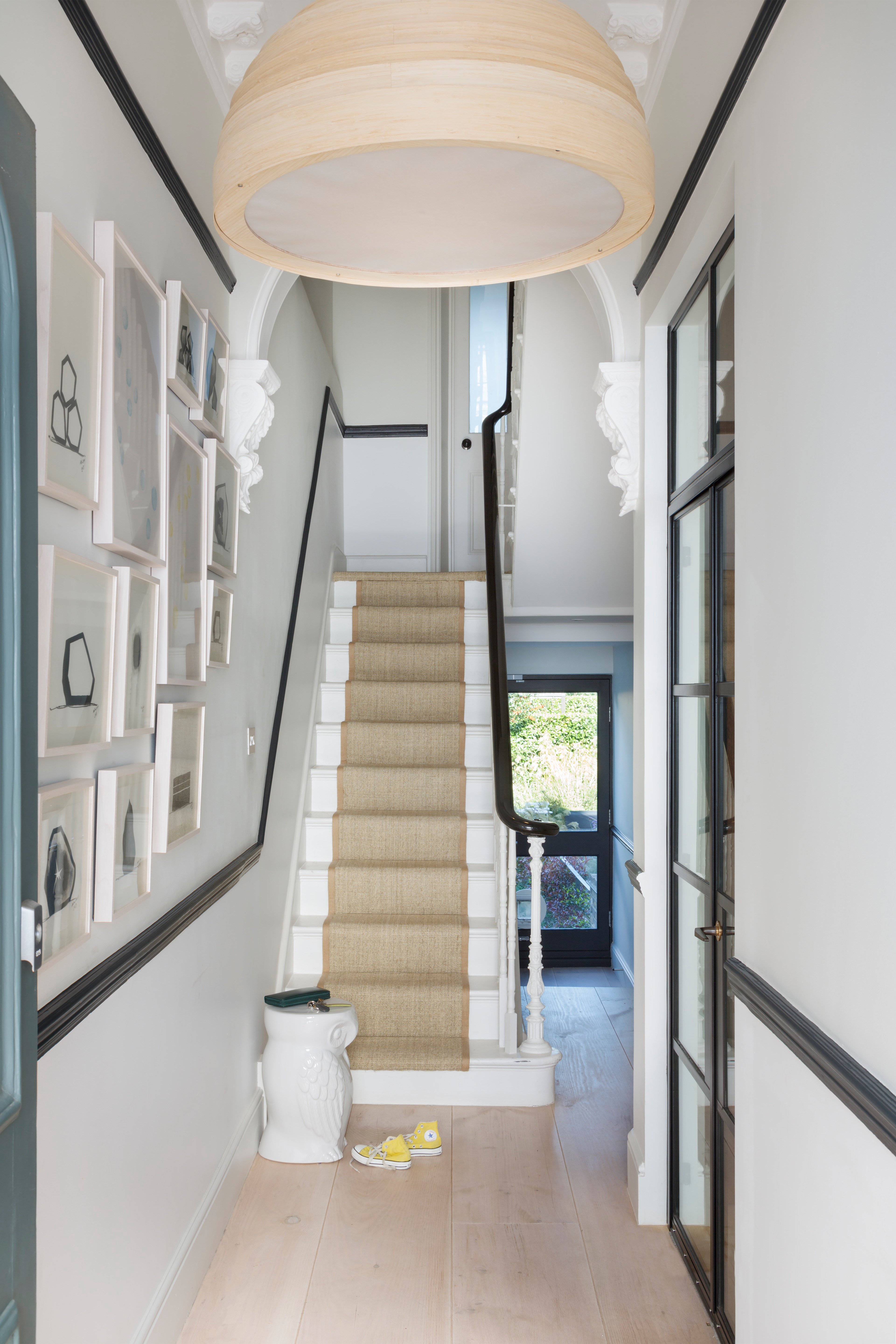 Black and white hallway with gallery wall