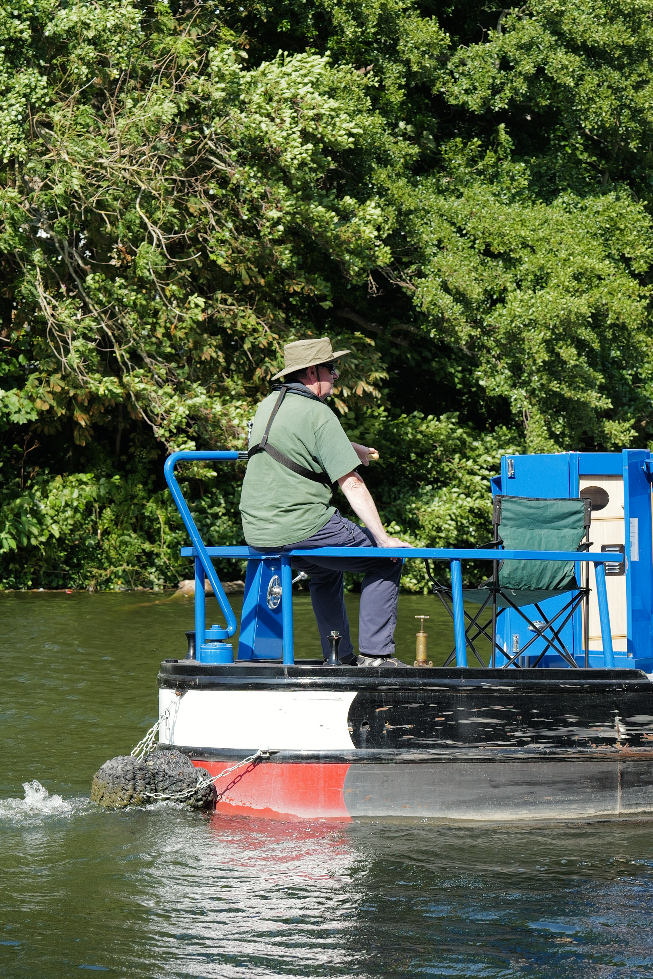 A photo of a man on a boat taken on a Leica Q3 43 camera