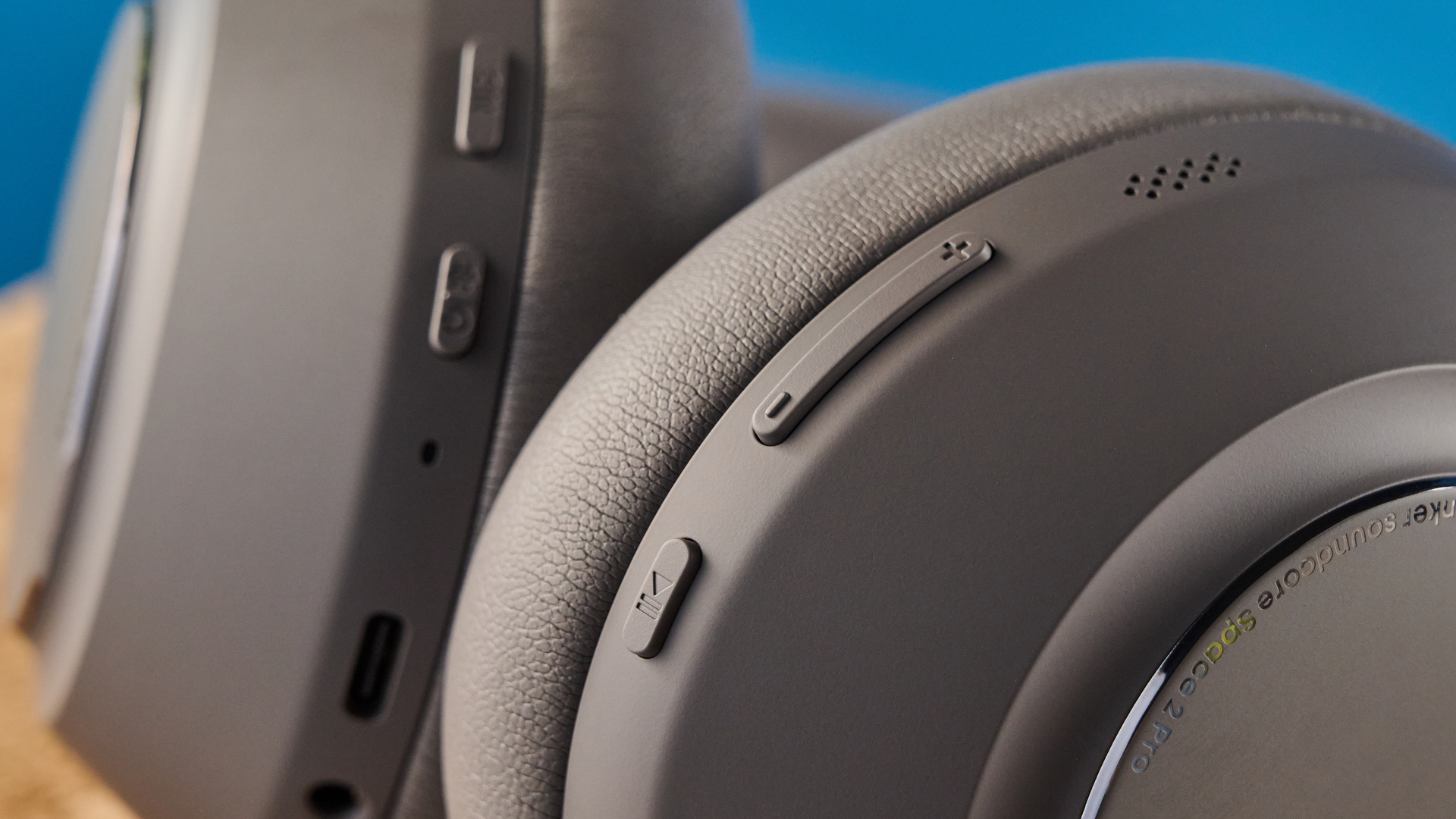 the anker soundcore space 2 pro headphones in mauve gray photographed against a blue tom's guide background
