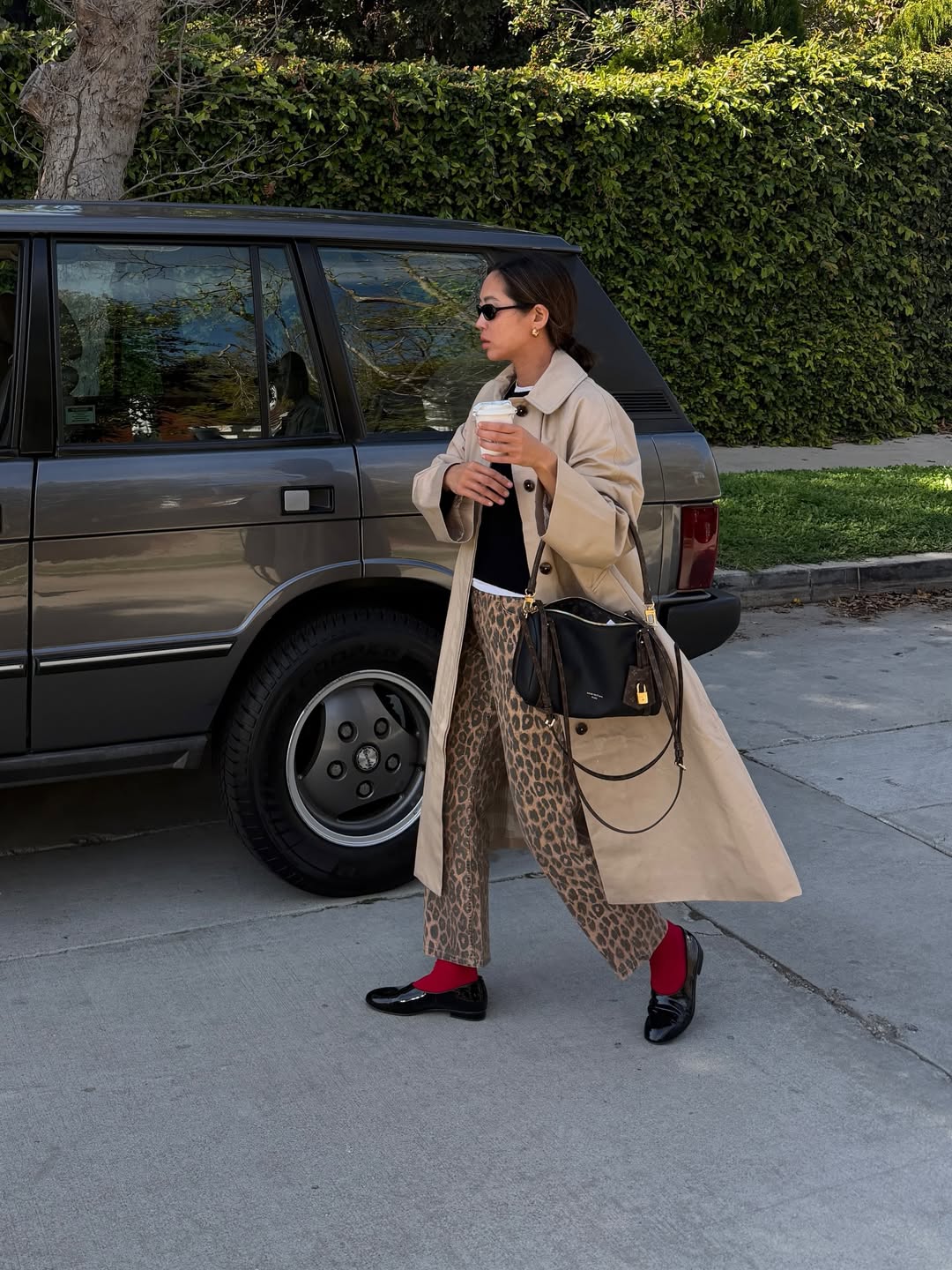 Aimee Song in black leather shoes