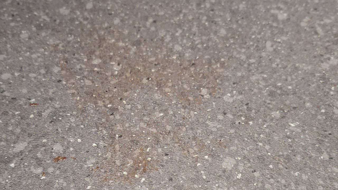 Smear of ketchup on lino floor before mopping test