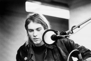 Kurt Cobain, seated behind a microphone at Hilversum Studios