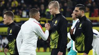 Kylian Mbappe and Erling Haaland shake hands ahead of a Champions League game between PSG and Borussia Dortmund in 2020.
