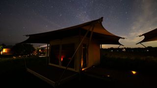 a tent against a starry sky