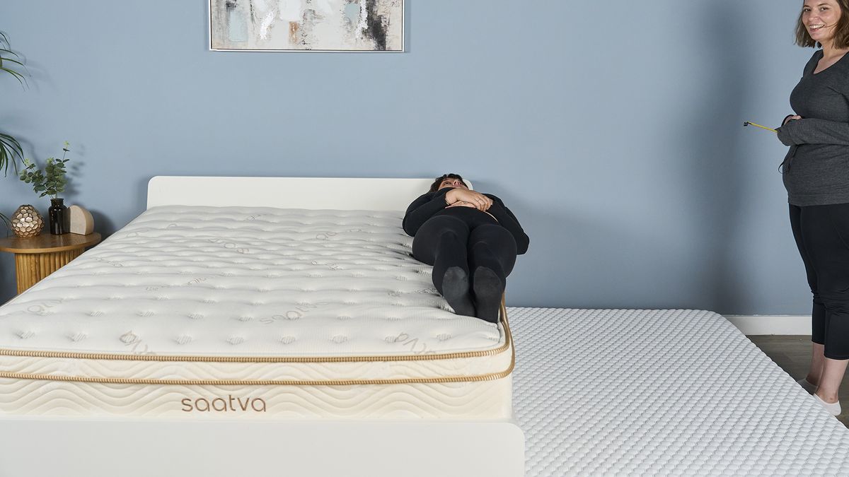Tom's Guide mattress tester Lauren Jeffries performing an edge support test on the Saatva Classic. The Saatva's edge support is so sturdy that 2.5