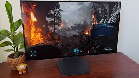 LG UltraGear Dual-mode monitor with Doom: The Dark Ages gameplay on screen.