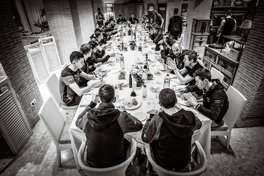The team sits down to some food