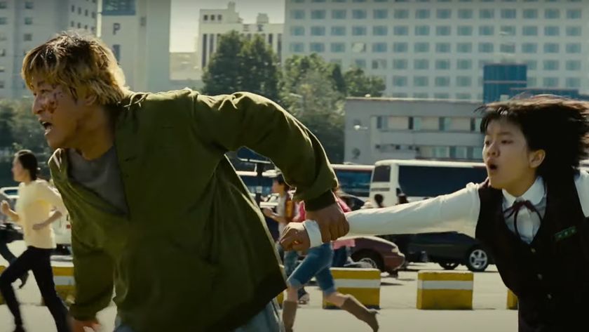 Song Kang-ho as Park Gang-du and Go Ah-sung as Park Hyun-seo running from a monster during the movie The Host. 