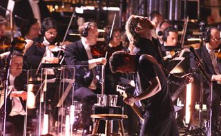 Jason Newsted and James Hetfield onstage with the San Francisco Symphony Orchestra