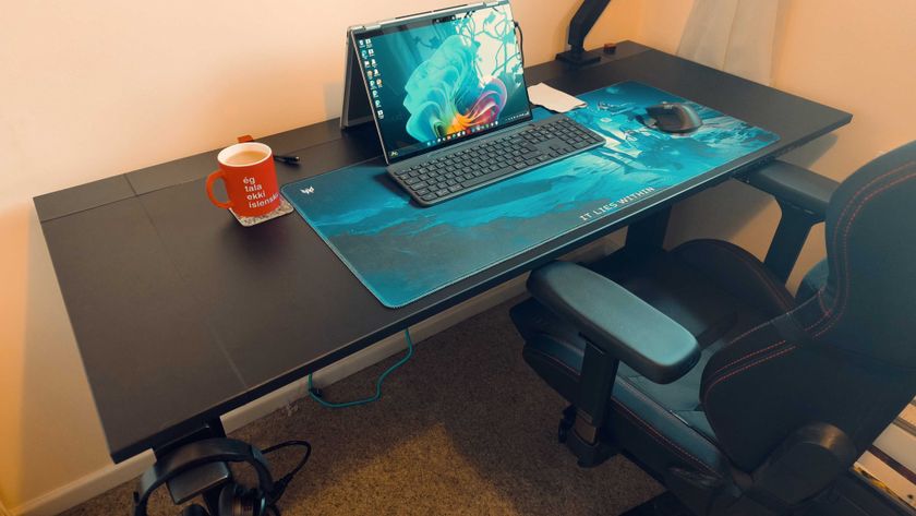 A black Secretlab Magnus Evo desk