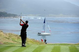 Tiger Woods tees off on the 92-yard par-3 7th hole during the final round of the 2010 US Open