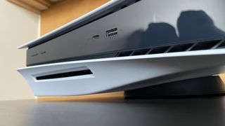 The front of a PS5 console showing the disc tray