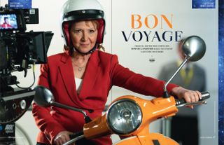 Bonnie Langford posing with the orange scooter she rides as Mel.