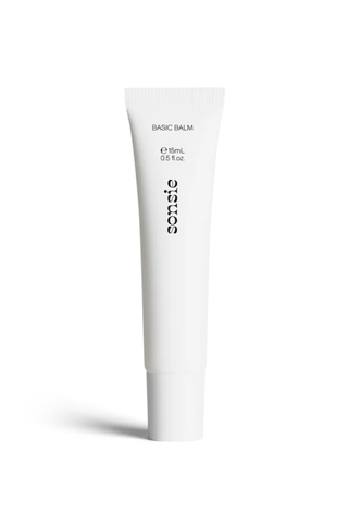 An unopened white tube of Sonsie basic balm against a white background.