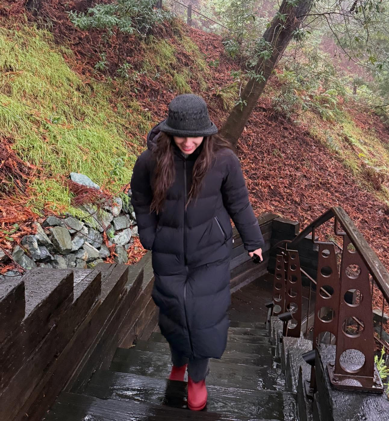 Olivia Rodrigo wearing a bucket hat and Aritzia puffer