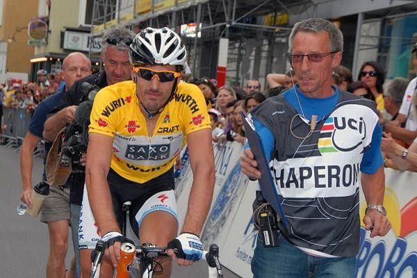 Fabian Cancellara (Team Saxo Bank) is accompanied by a UCI chaperone after stage two.