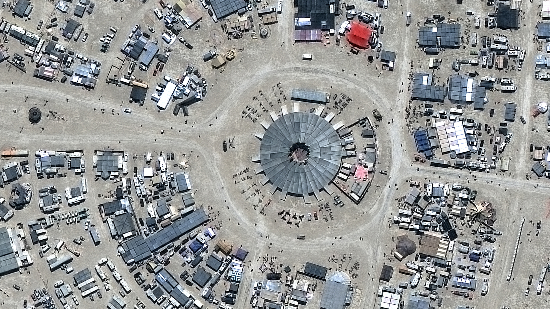Vantor satellite image shows the center of the Burning Man festival site in Black Rock City with its distinctive circular layout and numerous temporary structures