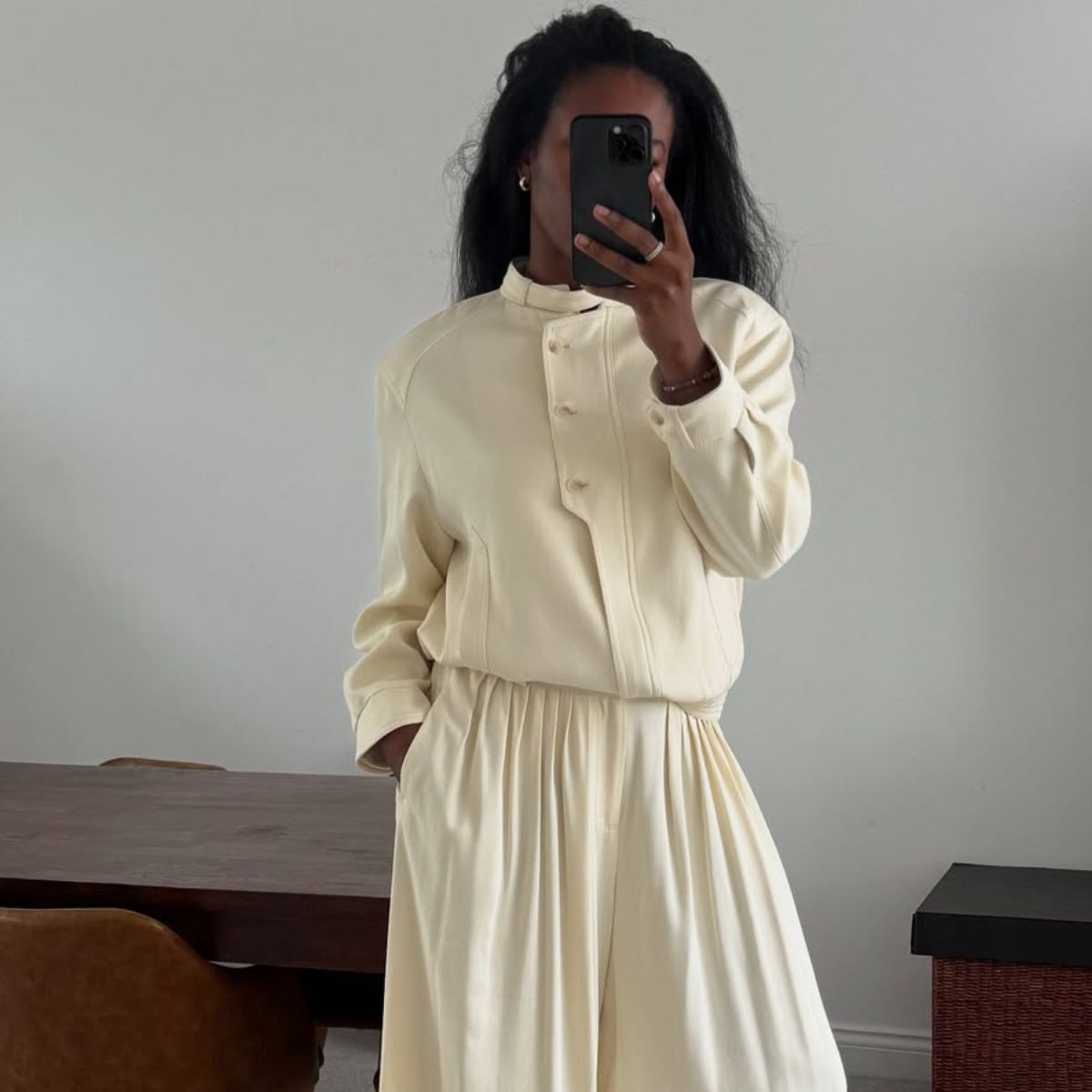 woman wearing white jacket and white skirt