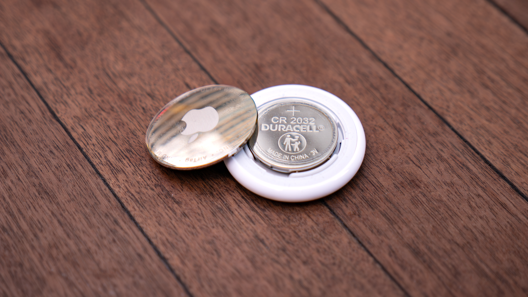 Apple AirTag 2 with battery showing.