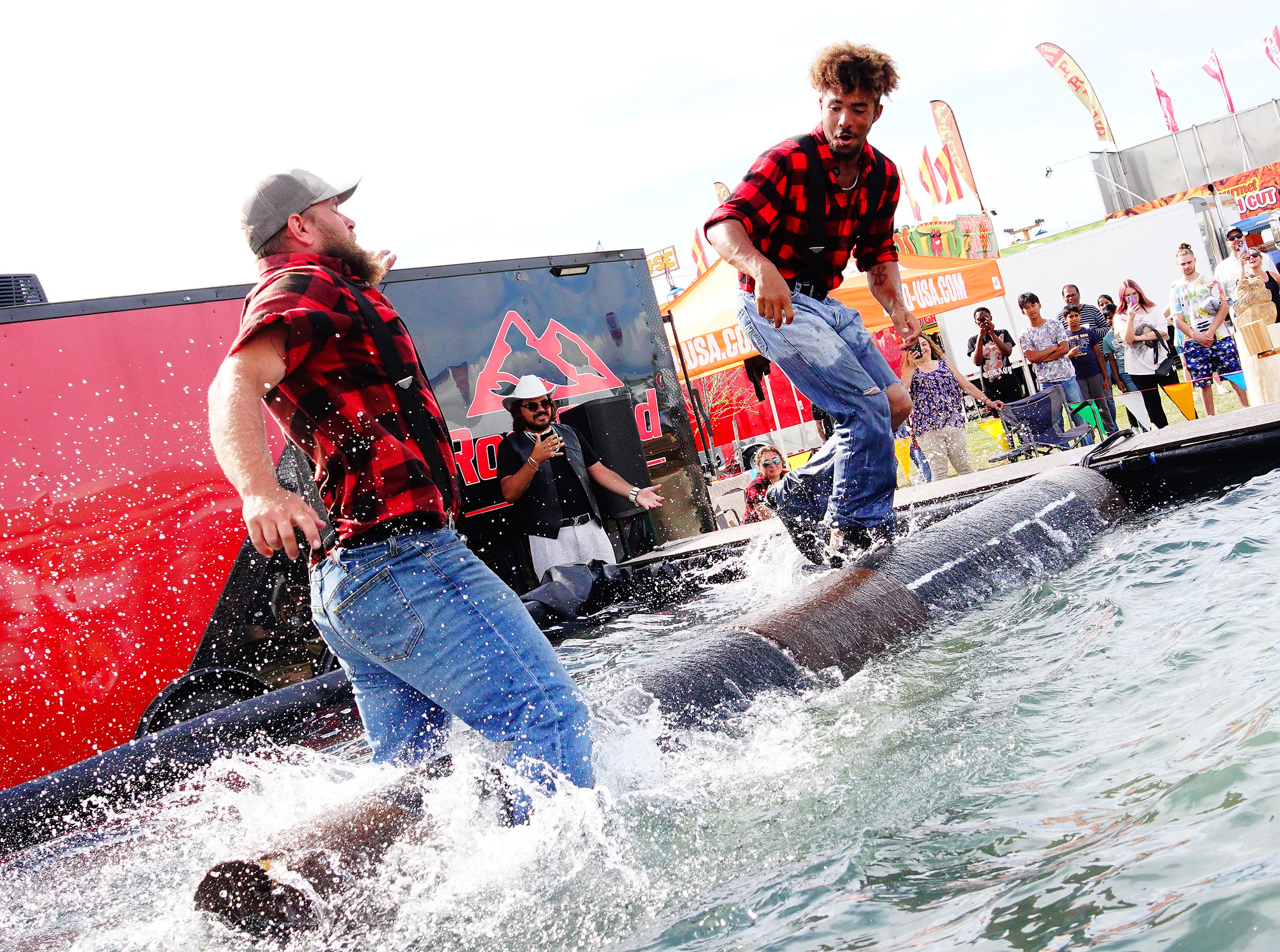 Two lumberjacks put on a log rolling show at the New York State Fair