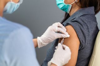 A person receiving a vaccine.