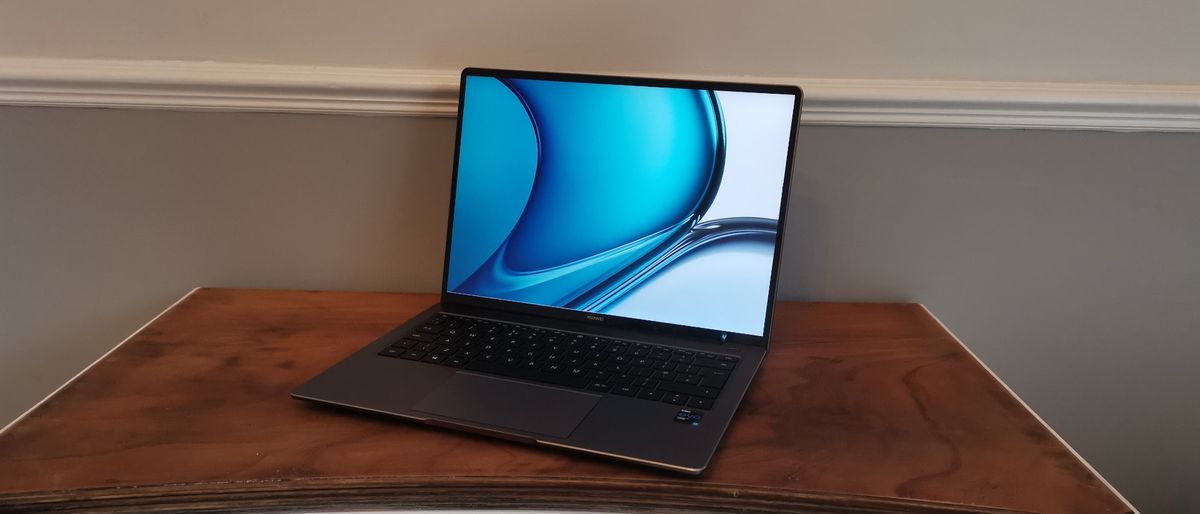 A Huawei MateBook 14s open on a dresser