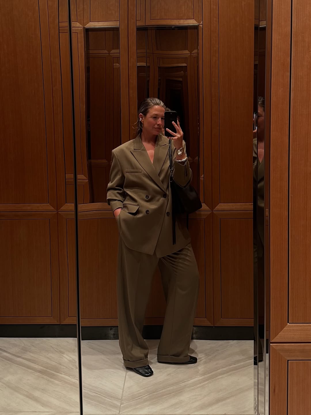 Alexis in a brown suit