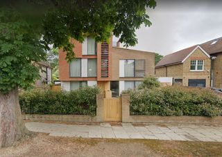 The exterior street view of the self build couple's eco home on Strawberry Hill