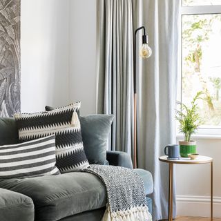 grey sofa with grey striped cushions