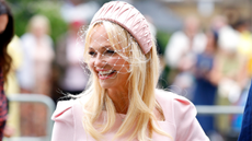Emma Bunton wearing pale pink dress and hat
