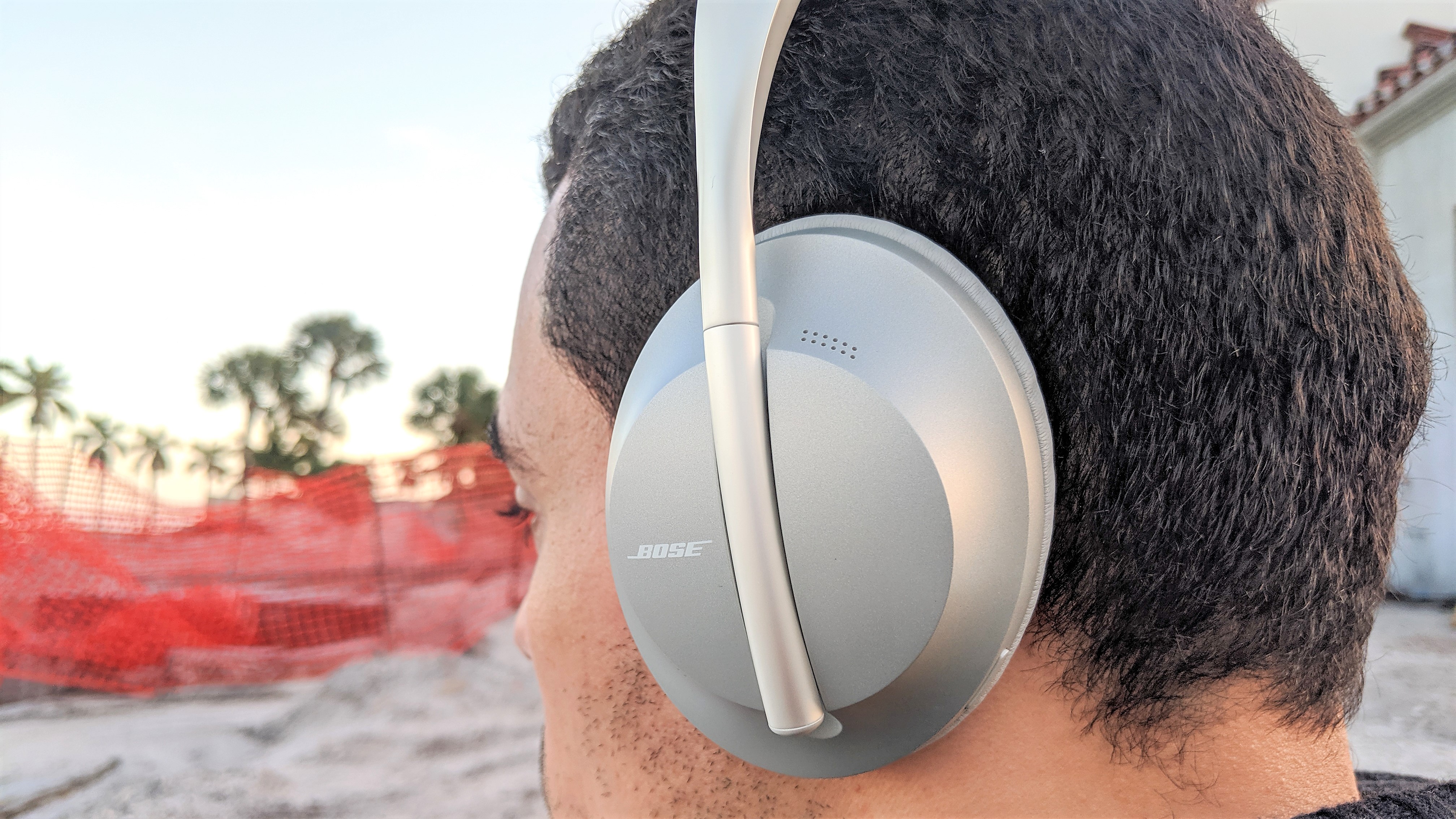 Bose 700 worn by reviewer testing ANC outside