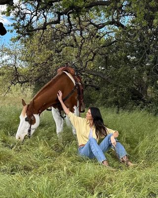 Kendall Jenner wears a yellow shirt.