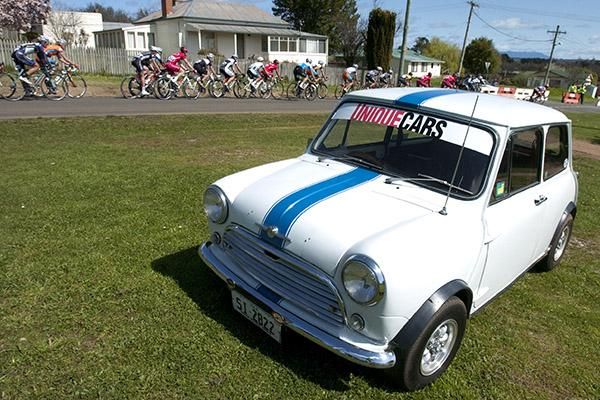 The tour roll by a car enthusiast's home in Westbury.