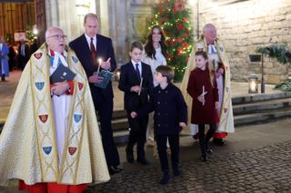 The Dean of Westminster Abbey, The Very Reverend Dr David Hoyle, Prince William, Prince of Wales, Prince George of Wales, Prince Louis of Wales, Catherine, Princess of Wales and Princess Charlotte of Wales attend The "Together At Christmas" Carol Service at Westminster Abbey on December 08, 2023 in London