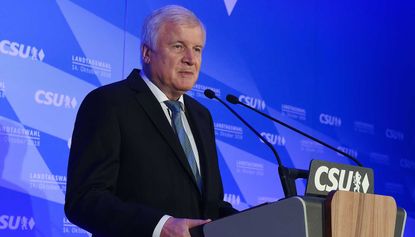 CSU leader Horst Seehofer claims mandate to lead despite heavy losses in state election
