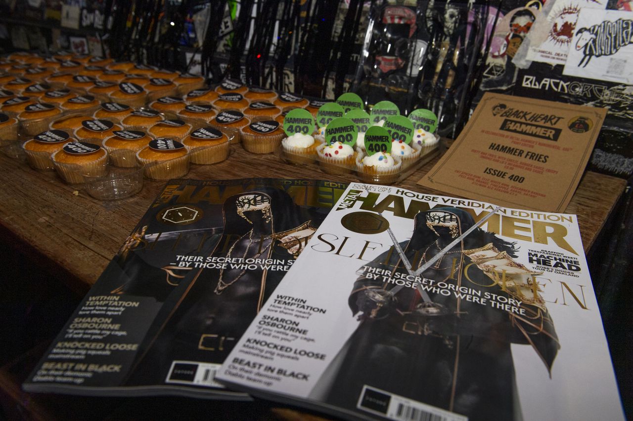 A table laid out with cakes and magazines