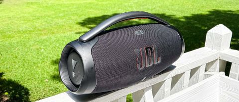 JBL Boombox 3 on a fence outside 