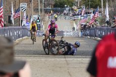 Katherine Sarkisov in the purple kit of CXD Trek BIkes hits the deck at the finish just before Cassidy Hickey of CCB also crashes in the U23 women's finish at USA Cycling Cyclocross National Championships