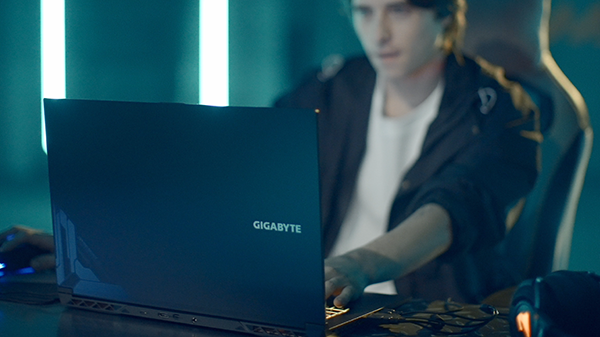 A Gen-Z gamer playing on a Gigabyte G-series laptop