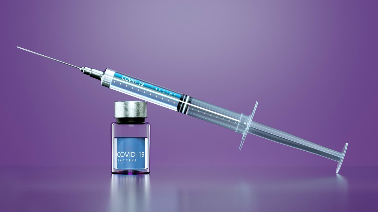 Digital generated image of Syringe with anti COVID-19 vaccine on purple background.