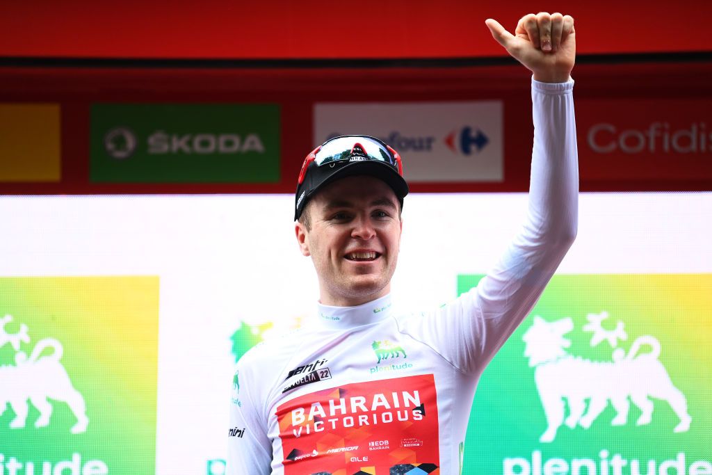 BILBAO SPAIN AUGUST 24 Fred Wright of United Kingdom and Team Bahrain Victorious celebrates winning the White Best Young Jersey on the podium ceremony after the 77th Tour of Spain 2022 Stage 5 a 1872km stage from Irn to Bilbao LaVuelta22 WorldTour on August 24 2022 in Bilbao Spain Photo by Justin SetterfieldGetty Images