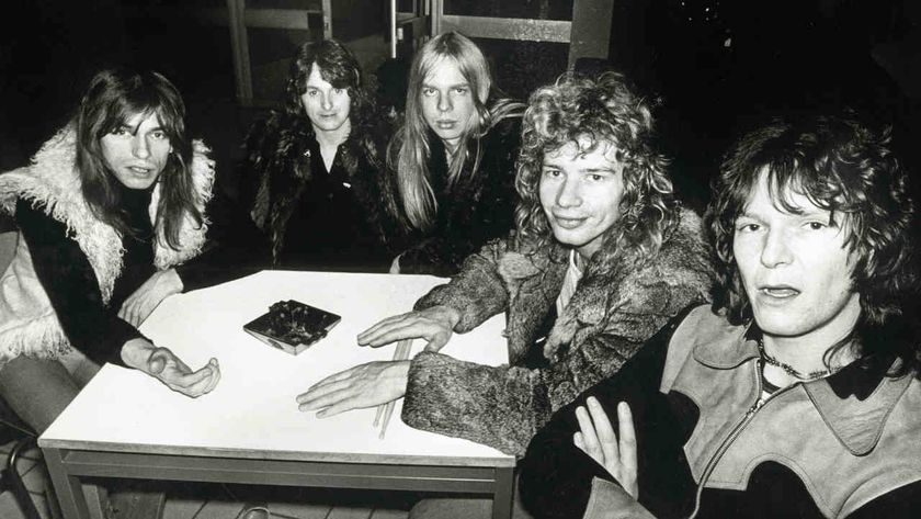 Yes pose for a group photo around a table in 1972